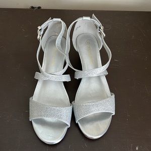 Sparkly silver 1”wedge heel with ankle cris cross straps and strap across toes